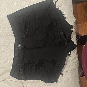 Black denim mid rise ripped shorts